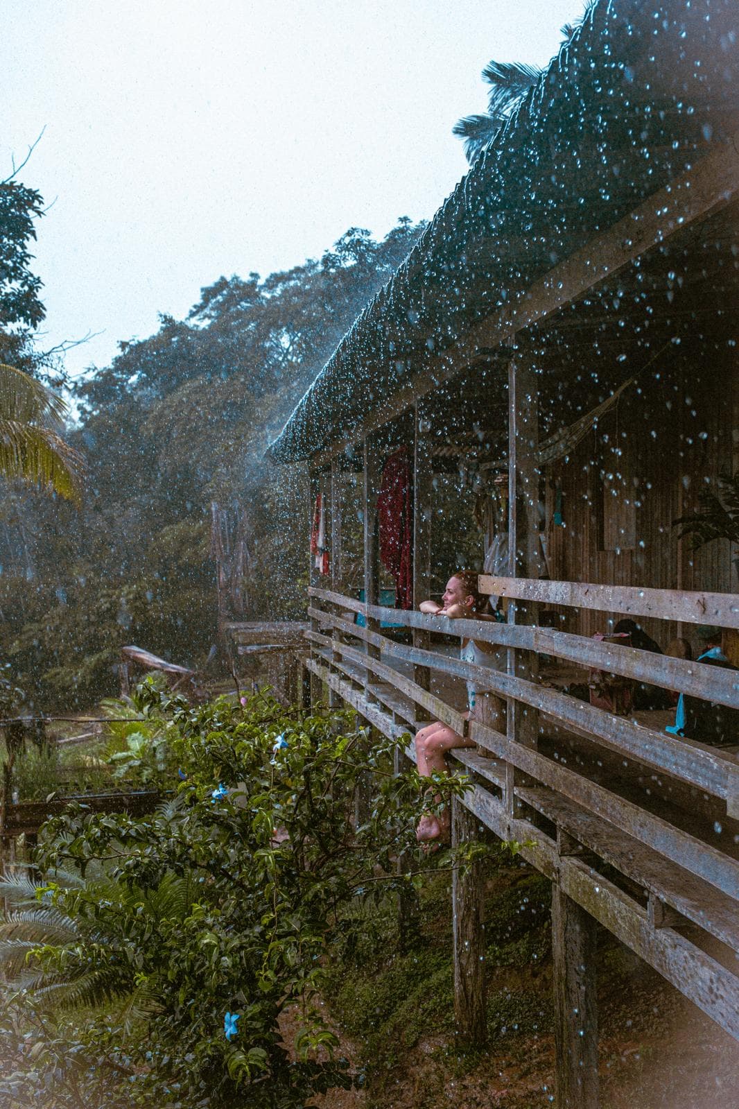 Nikolina Momcilovic smiling in the rain, symbolizing resilience, authenticity, and her holistic approach to career coaching.
